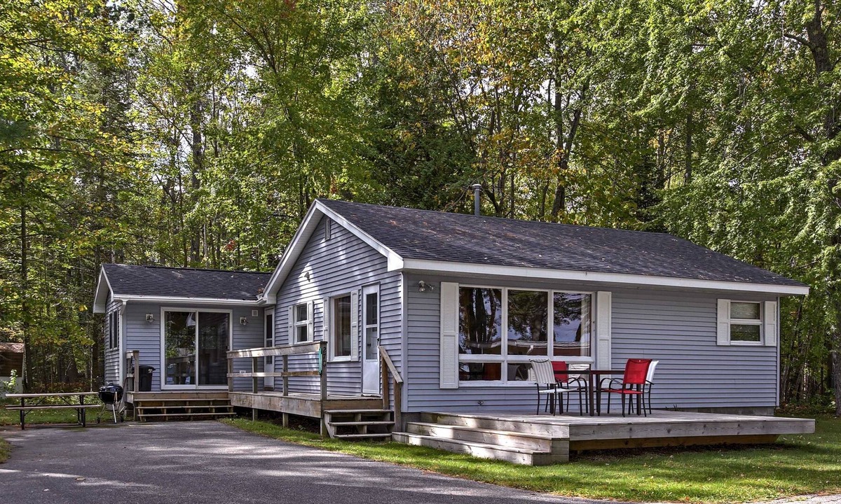 Burt Lake House | Cozy Alanson Cabin - steps to dock on Lake Burt!