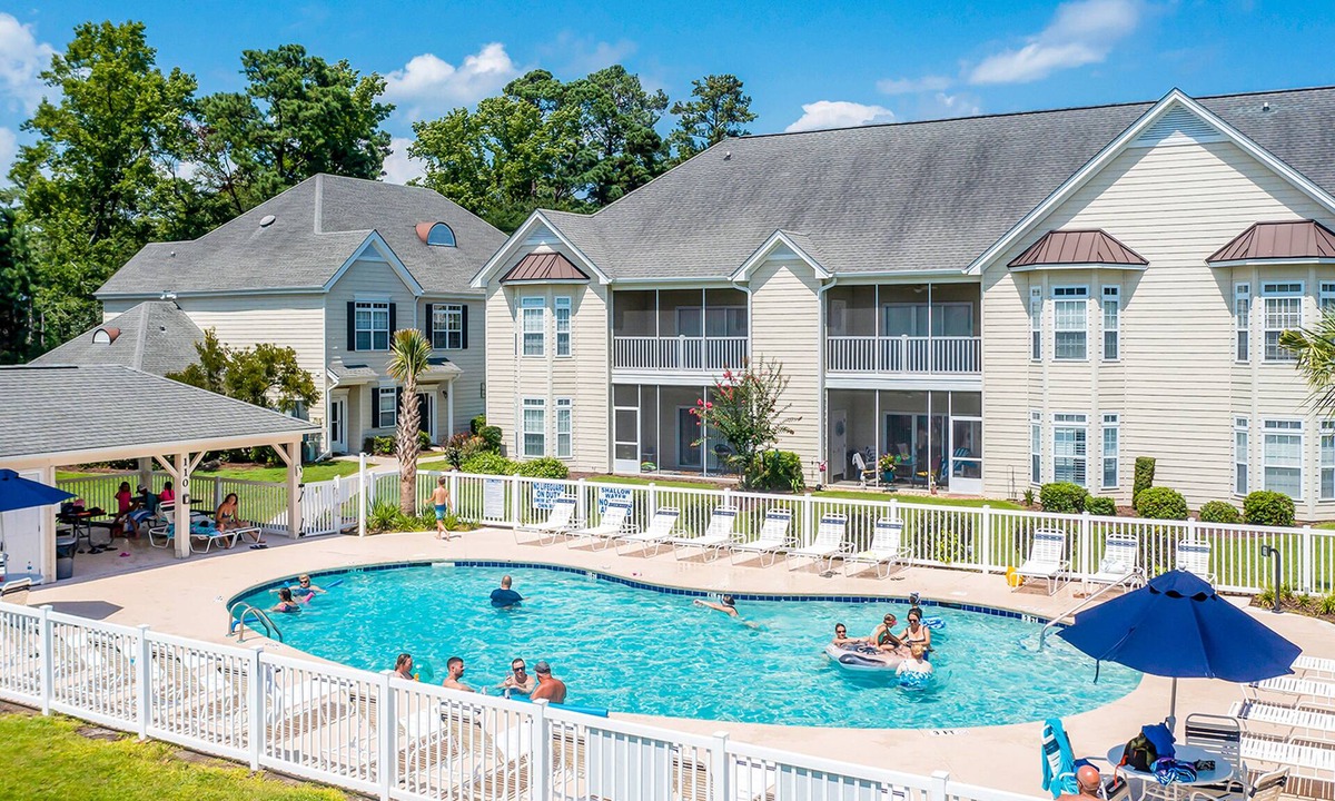 Little River Condo | Lake-view ground-floor condo with screened patio, W/D, & pool