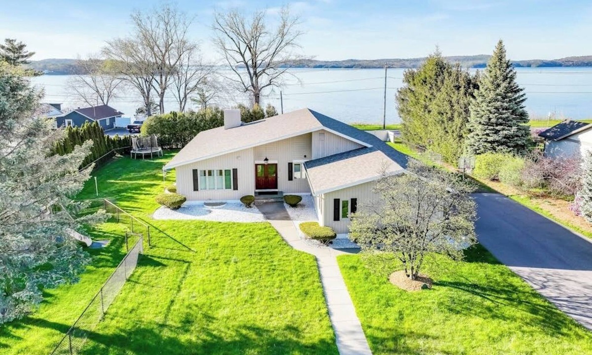 Colchester House | Lakefront home with pool, beach access, central AC, washer/dryer, & fireplace