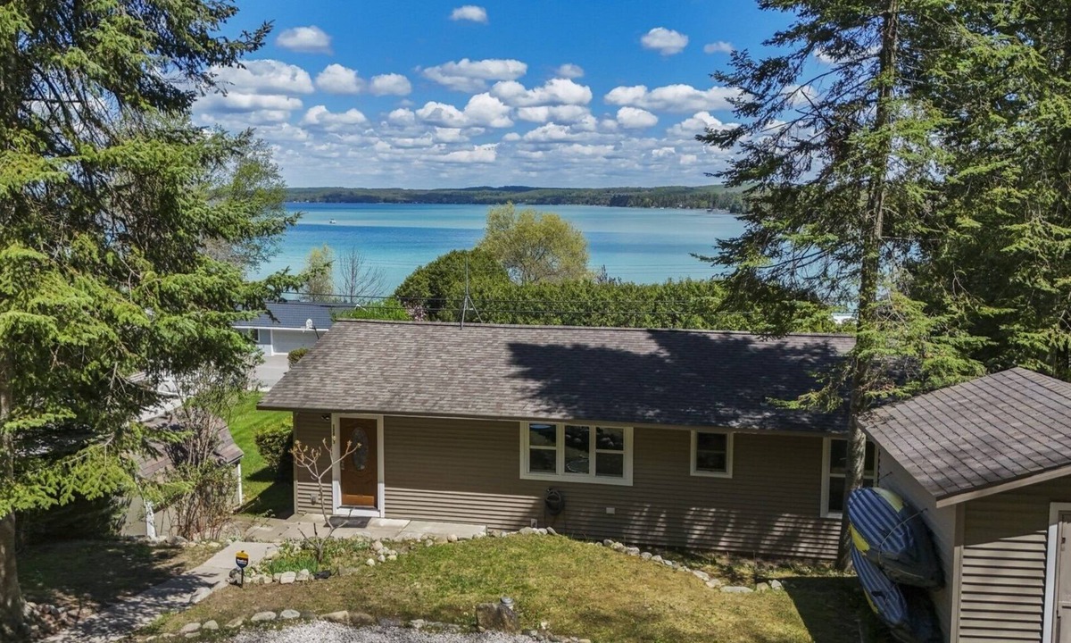 Rapid City House | NEW! Beautiful Torch Lake House with Beach Access
