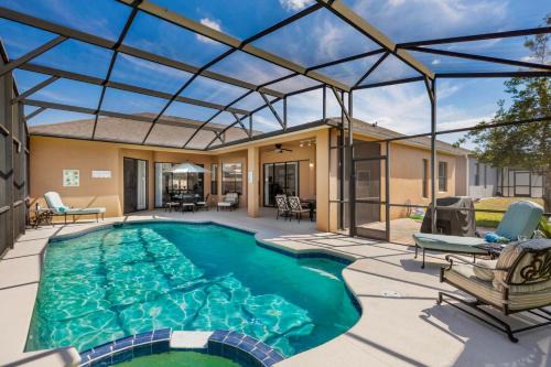 Legacy Park House | Orlando Retreat 5BR Pool and Spa Villa with Games Room and Mickey Themed Room
