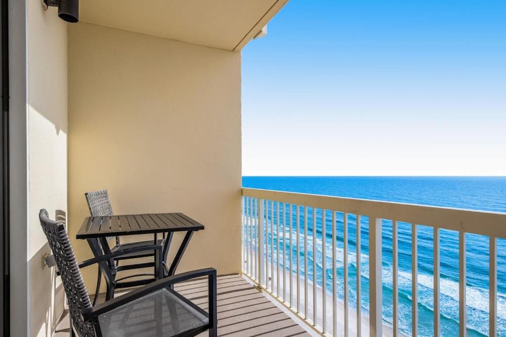 Miramar Beach House | Sunny oceanfront condo with two shared pools hot tub - walk to the beach