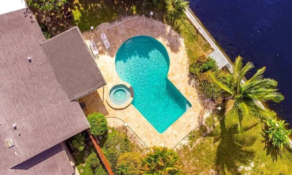 North Central Hollywood House | Waterfront Paradise with Tropical Palms, Swimming Pool & Hot Tub + Huge Backyard