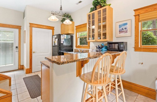 Historic Downtown Manteo House | 1BR historic cottage w/fireplace, patio & tub