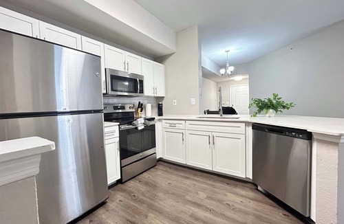 Westchase Apartment | 2 BR with Private Garage, Boutique Shops & Pond Views