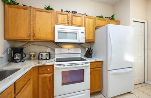 Regal Palms House | 4 bdrm townhouse - 2 king size bdrm suites; next to pool, lazy river and Disney!