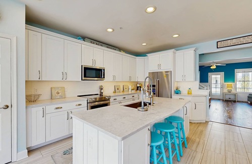 Sunset Island Condo | 4-story townhome with resort pools, beaches, water access, & great location