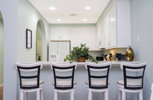 West Kissimmee Condo | 9.1 miles from Disney World, Sleeps 8-10, heated pool, hot tub, private balcony