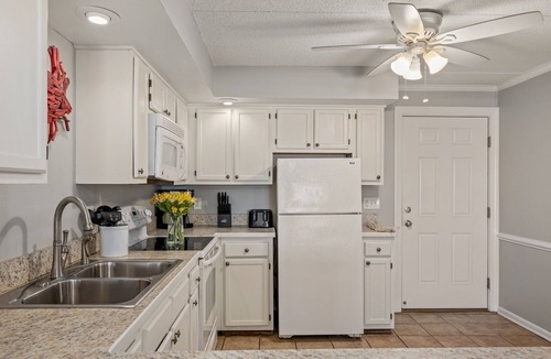 South Nags Head Condo | Beachfront Condo with Private Patio and 2 Pools