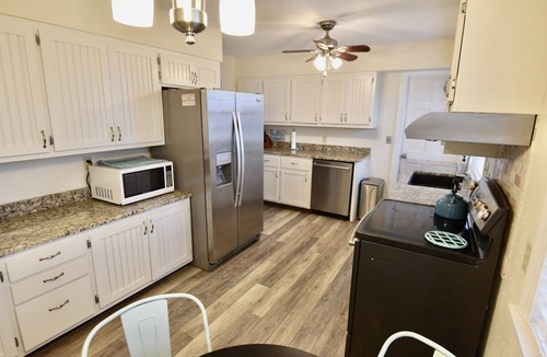 Frisco House | Canal Front Home with a Dock and Hot Tub minutes from the beach!