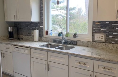 Rapid City House | Caribbean-Blue Elk Lake Escape Remodeled 6BR Waterfront Retreat.