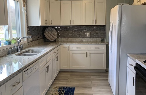 Rapid City House | Caribbean-Blue Elk Lake Escape Remodeled 6BR Waterfront Retreat.