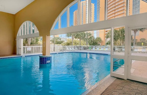 Miramar Beach House | Colorful oceanfront condo with Gulf views on-site pools & hot tub