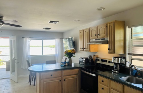 Goodland Apartment | Direct panoramic waterfront views