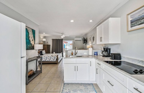 Bay Esplanade Apartment | Enchanted Inn Suite #4: Waterfront, Pool, Fishing Dock, Boat Docks & Tiki Bar!