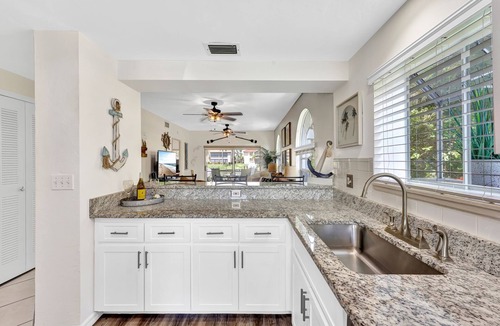 Caloosahatchee Villa | Enchanting tropical waterfront villa with boat slip, bikes, kayaks heated pool!