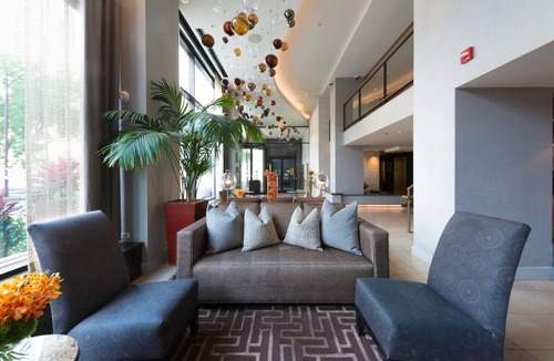 Near North Side Hotel | Experience Comfort in Eco-friendly Room w/Earth Tone Furniture