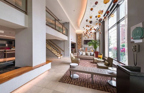 Near North Side Hotel | Experience Comfort in Eco-friendly Room w/Earth Tone Furniture