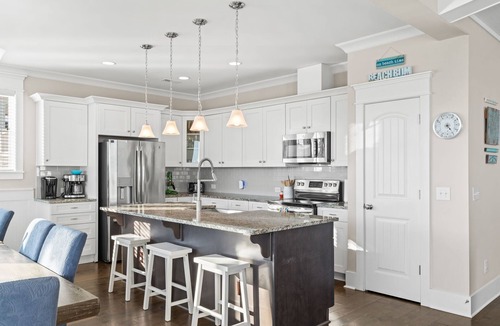 Yaupon Beach House | Experience ocean views at Panama Breeze, a spacious 6-bedroom retreat in Oak Island.