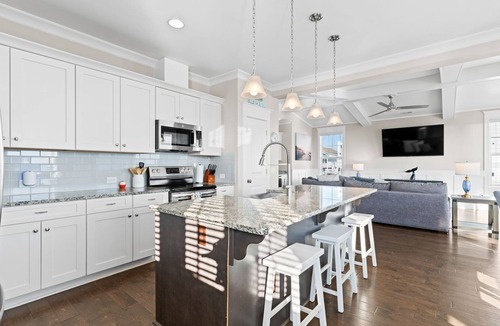 Yaupon Beach House | Experience ocean views at Panama Breeze, a spacious 6-bedroom retreat in Oak Island.