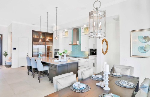 Island Estate House | Exquisite Clearwater Retreat w Heated Pool Game Room Outdoor kitchen and Kayaks