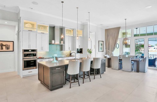 Island Estate House | Exquisite Clearwater Retreat w Heated Pool Game Room Outdoor kitchen and Kayaks