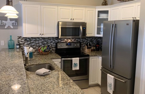Fort Bay House | Gated Quiet Private Beach - Gulf Pool - Free Beach Chair service March to Oct