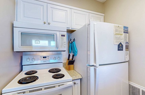 Fort Bay Condo | Gorgeous beachfront condo with shared pool, hot tub and beach access