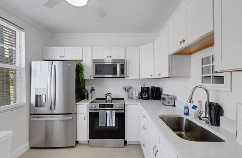 Bay Esplanade Condo | 🌴 Ground Floor Condo @ Clearwater Beach Suites | Steps to Sand Heated Pool ➠ CBS 102