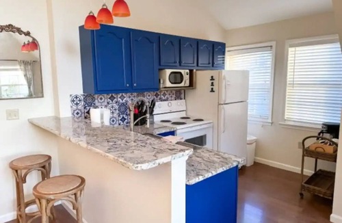 Salisbury Apartment | Havana Hideaway: A tropical retreat where vibrant decor meets pastoral views.