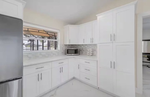 Mariner House | Home with heated pool and a pool table in Cape Coral