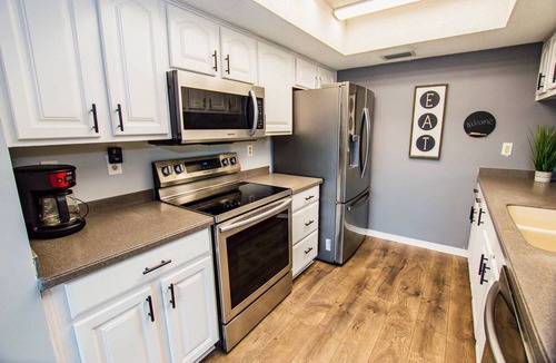 Saddlebrook Condo | Lakeview Townhome Retreat | Workspaces & Patio | Optional Saddlebrook Resort Amenities
