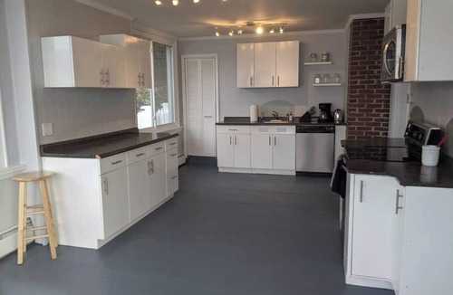 Dedham House | Light-filled lakefront home for up to 15 with private beach and dock near Acadia