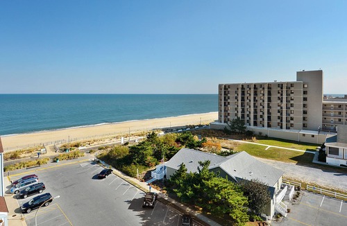 Rehoboth Beach Condo | LINENS & DAILY ACTIVITIES INCLUDED! OCEANFRONT/BOARDWALK BUILDING W/ROOFTOP POOL Furnished for comfort after a day in the sun. Relax in this 1100 sq ft unit with great southern exposure and lovely ocean views
