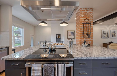 Collister House | Luxury at its Finest | Indulge in Gourmet Kitchen, Spacious Dining Area, & Plush Beds