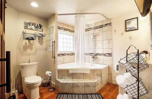 Logan Hotel | Luxury King suite with air-jet jacuzzi , private entrance & deck