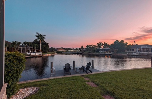 Cape Coral House | Luxury south facing waterfront home with heated salt pool and spa!