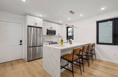 Jeffries Point Apartment | Modern Coastal City Stay | Waterfront & Airport
