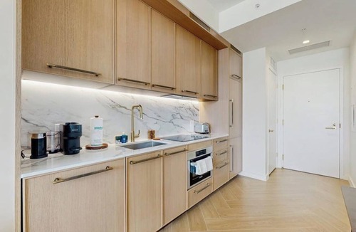 Wynwood Art District Condo | Modern condo with skyline views, rooftop pool & private balcony