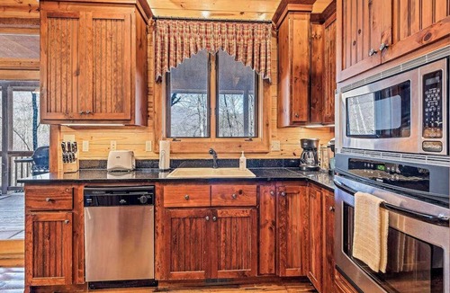 Tuckasegee House | Mountain cabin with wrap-around balcony, games, fireplace, & children's items