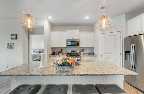 Ocean View House | Ocean View Beach Club home with bay view, private tennis court & pool access