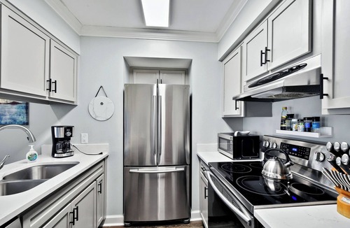 East Beach Condo | Oceanfront Condo - Private Boardwalk - Pool & Balcony