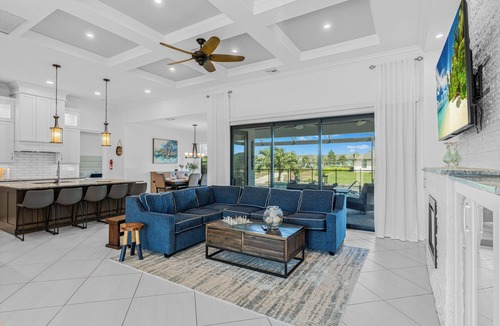 Trafalgar Villa | Relax at Coastal Vibes: Heated Saltwater Pool & Spa Game Room Waterfront View