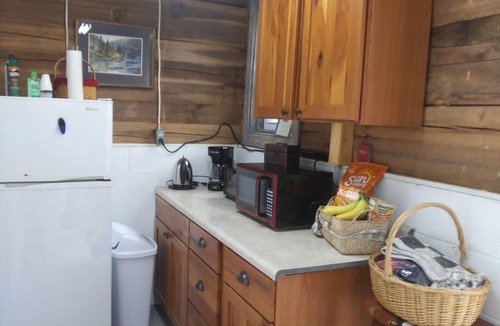 Murphy RV Rental | Relax in a Safari Glamp Tent beside the creek, firepit- outdoor experience.