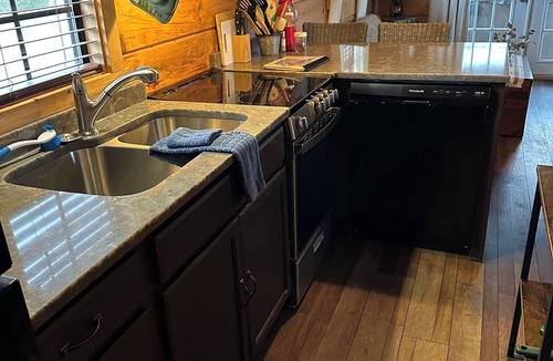 Altamont Cabin | Riverfront Escape: Fire Pit, private hot tub, river fun, sleeps 6