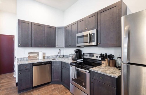 West Poplar Apartment | Sosuite | 2BR Penthouse w W/D, Gym, On-Site Bar