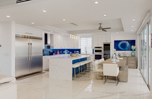 Sexton Cove Estates House | Sprawling waterfront home with pool, outdoor kitchen, game table, grill, & W/D