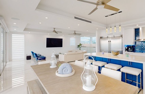 Sexton Cove Estates House | Sprawling waterfront home with pool, outdoor kitchen, game table, grill, & W/D