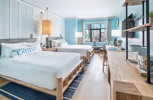 East Village Hotel | Sunny Escape with Vibrant Live Music & Poolside Bar