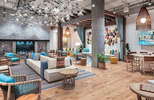 East Village Hotel | Sunny Escape with Vibrant Live Music & Poolside Bar